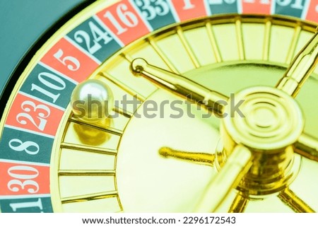 Close up of a roulette ball, gambling concept : Roulette ball lands in the number 10 pocket on a wheel. Roulette ball is a ball that is spun around a roulette wheel to determine the winning number.