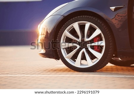 Close up view of tire of the modern automobile. Beautiful sunlight.