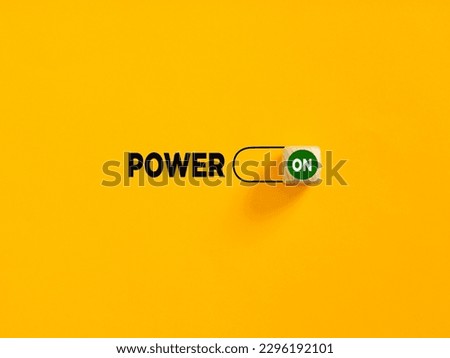 Power on slider button on yellow background. Power and motivation concept.