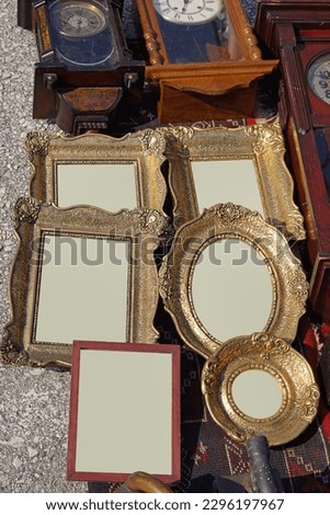 Empty gold picture frames at for sale flea market