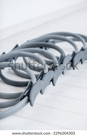 gymnastic ring for pilates of gray color on a light background