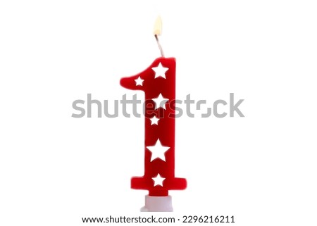 Number 1 birthday celebration candle against a bright white background, burning party candle for one year old. Happy Birthday concept colorful red Royalty-Free Stock Photo #2296216211
