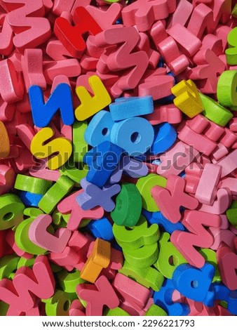 pile of colorful wooden letter puzzles, handmade,