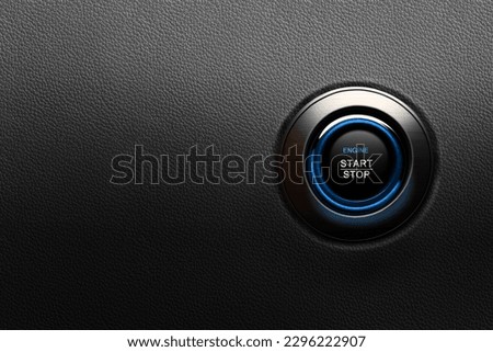 Engine Start Stop button on modern car. Black leather textured dashboard, copy space Royalty-Free Stock Photo #2296222907