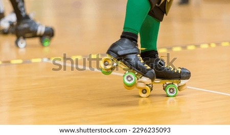 Roller skates of a person participating in roller derby. .
