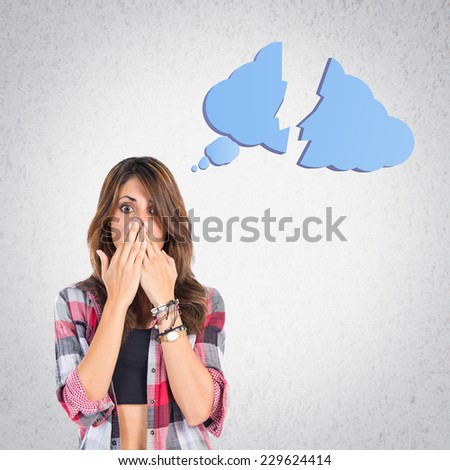Girl doing surprise gesture over grey background 