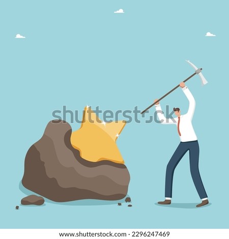 Achieving goals through hard work, highest result in deeds and work done, career advancement, productivity or success in solving business problems, man a breaks cobblestone with a pick to find a star. Royalty-Free Stock Photo #2296247469