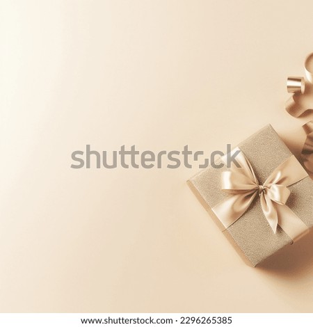 Gift box with gold ribbons on pastel-powder background with blank space for text. Gift for mother's day, birthday, March 8. Royalty-Free Stock Photo #2296265385
