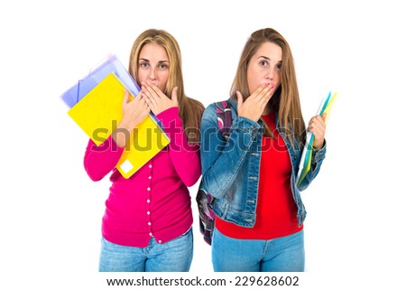 Student women doing surprise gesture over white background  
