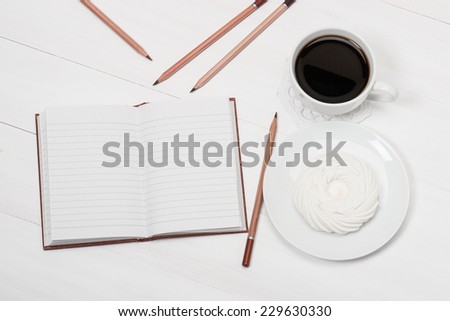 Notebook Mock Up And Cup Of Coffee On White Painted Wooden Desk.
