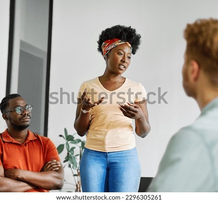 Group psychotherapy. Persons sitting in circle and talking. People meeting. Psychotherapy training, business lecture or conference. Man woman support group. Young businesspeople having a meeting 
