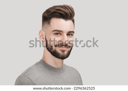 Smiling man studio portrait isolated. People, male beauty, student, lifestyle concept Royalty-Free Stock Photo #2296362525