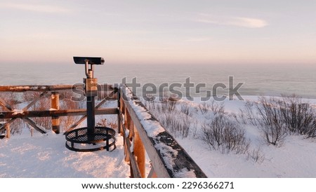 The coast of the Baltic Sea on the Curonian Spit is covered with snow Royalty-Free Stock Photo #2296366271