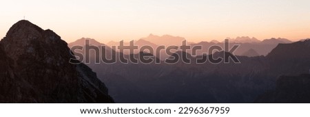 Panoramic view over the ridgeline near the summit of Nebelhorn at sunrise in the Allgäu alps - south Germany.