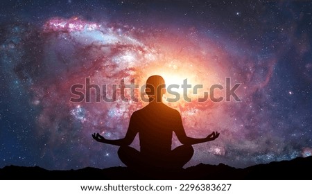 Silhouette of human sitting on stars background. Meditation in yoga. Psychology and relax Royalty-Free Stock Photo #2296383627