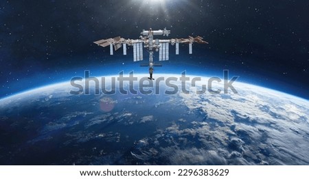 Space station on orbit of Earth planet. Blue planet and ISS in deep space. Elements of this image furnished by NASA Royalty-Free Stock Photo #2296383629