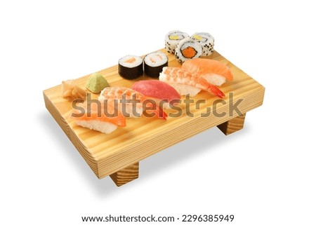 Sushi Rolls on bamboo board isolated on White background Royalty-Free Stock Photo #2296385949