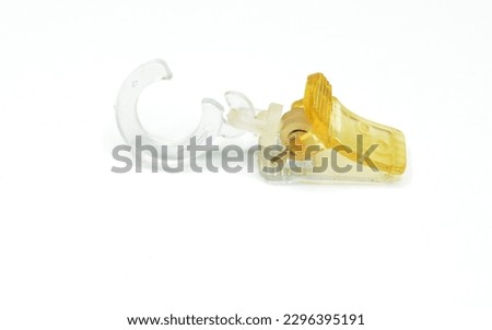 Vintage plastic curtain clip on white background