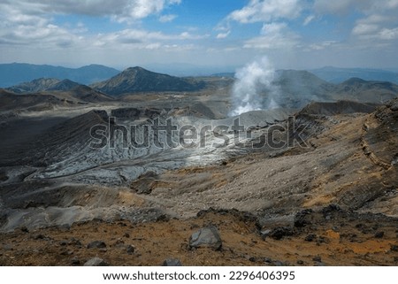 Mount Nakadake is one of the five peaks that make up Mount Aso, the largest volcano in Japan. Royalty-Free Stock Photo #2296406395