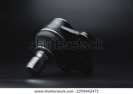 Tie rod end, tie rod end with and without shadows, auto parts new on black background Royalty-Free Stock Photo #2296442471