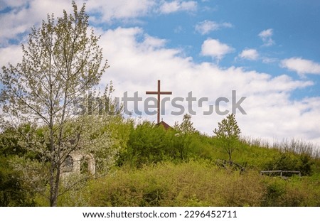 Landscape with a cross in a mountain village