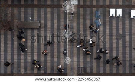 cenital picture people walking in the streets of the city to go shopping at christmas time . concept shopping