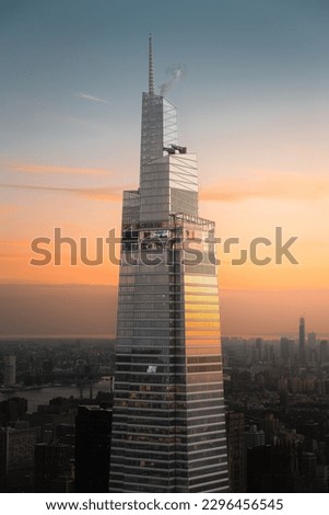 View of a modern Manhattan's skyscraper during sunset at golden hour, in New York City, USA.