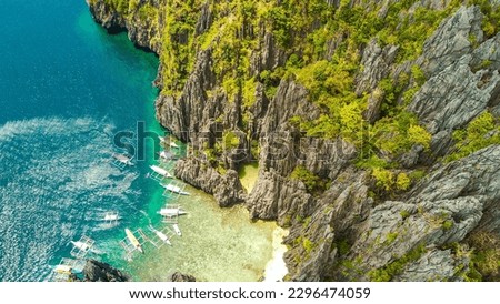 Aerial photos with drone of the Nido in the Philippines, with a view of the islands, sea and boats, during a sunny day