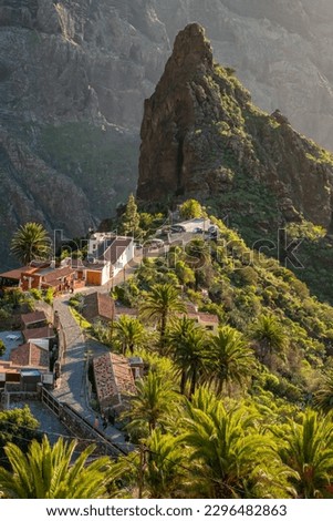 Landscape of the Masca valley in Tenerife, Canary island, Spain. Scenic mountain landscape with palm trees and tropical vegetation in Tenerife. Famous volcanic rock formation in Masca village Royalty-Free Stock Photo #2296482863