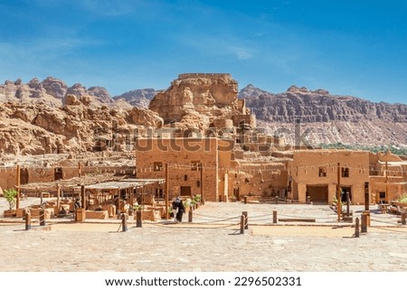 Al Ula old town ruined mud huts with city castle, Medina province, Saudi Arabia Royalty-Free Stock Photo #2296502331