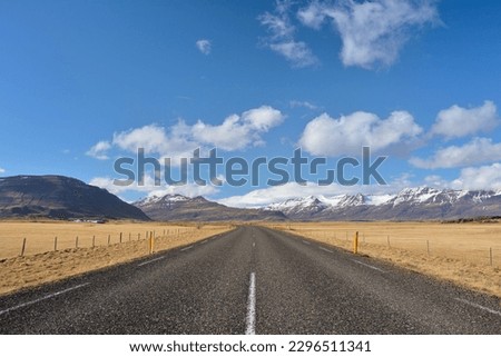 Iceland ring road with mountains on the background Royalty-Free Stock Photo #2296511341