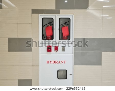 Fire Hose Cabinet in tiled wall