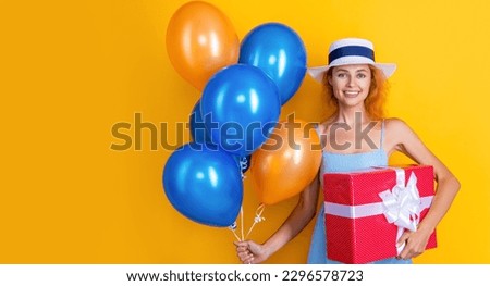 birthday woman with present on banner background, copy space. photo of birthday woman