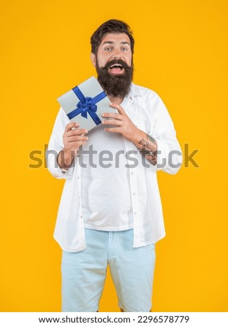 image of happy birthday man with purchase box. caucasian birthday man with purchase