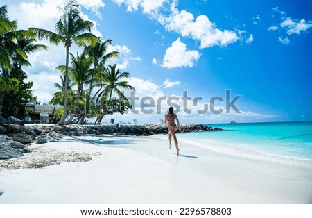 photo of woman running on summer vacation. woman running on summer vacation at beach