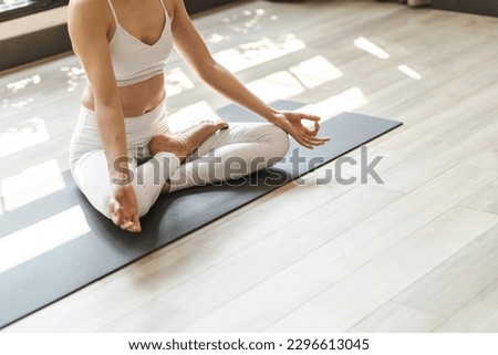 Easy Seat pose Female Attractive asian woman doing yoga stretching exercise on mat yoga  fitness exercises. Healthy lifestyle Calmness and relax at home Royalty-Free Stock Photo #2296613045
