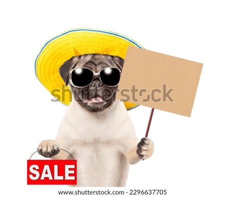 Pug puppy wearing sunglasses and summer hat showing signboard with labeled "sale" and empty placard. isolated on white background