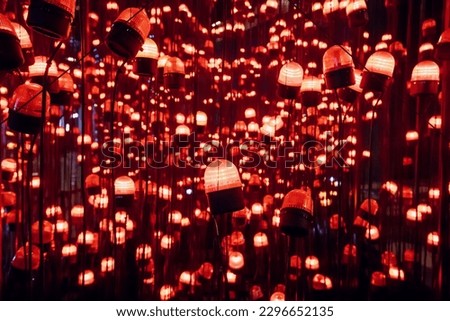 Many illuminated and glowing red flash as background Royalty-Free Stock Photo #2296652135
