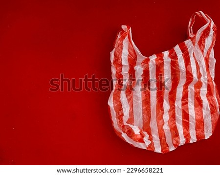 Trash plastic bag with red screen fabric for background suitable for photography journalistic, article, website banner, background