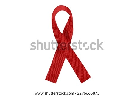 Photo of red awareness ribbon isolated on white background. Contains clipping path around ribbon.