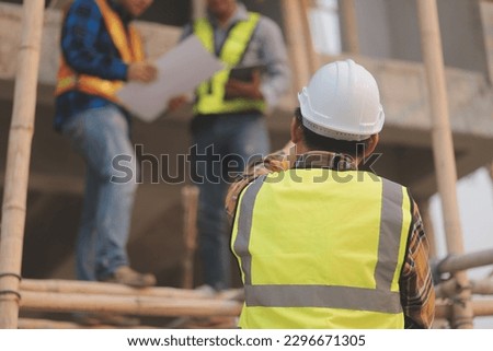 aerial view of construction worker in construction site Royalty-Free Stock Photo #2296671305