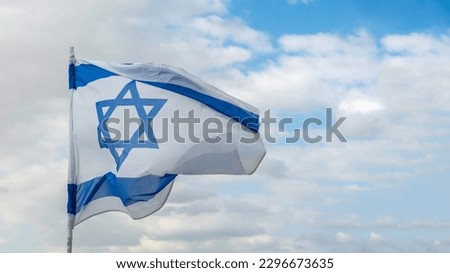 Flag of Israel for Independence Day on blue sky background.