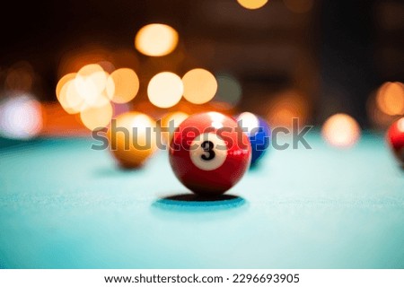 Closeup shot of a number 3 ball on a pool table