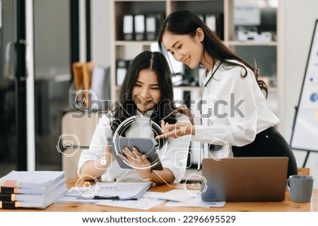 Working woman team meeting concept, business using laptop and smart phone and digital tablet computer with digital marketing media  in virtual icon network diagram office in morning light

