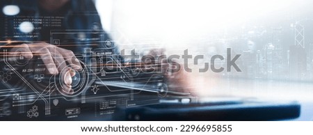Software engineer working on tablet and laptop computer with big data on virtual screen, technology network, cloud computing, data exchange and software development, data science and system management