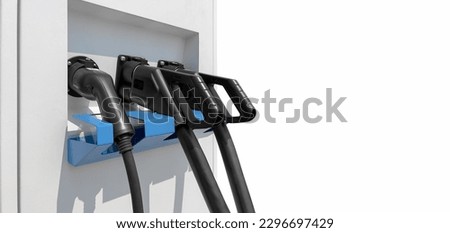 Close-up photo of the charging head of an electric vehicle charging station isolated on white background