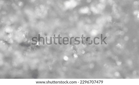 Silver grey vintage bokeh background defocused for festivals and celebrations. Defocused picture of an icy sheet