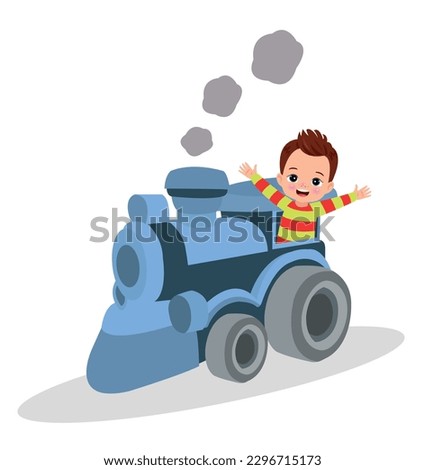 A boy is standing in front of a train