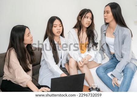 Business asian women group discussion business plan with laptop in home office