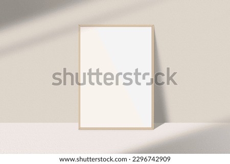 Realistic portrait photo frame mockup. Wooden frame mockup on the table with light window shadow overlay effect. Simple, clean, modern, minimal empty poster frame mock up. White picture frame mockup